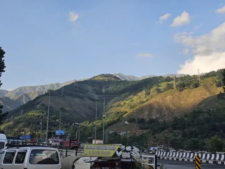 Breathtaking vista of the winding Himalayan highway winding across verdant mountain ridges